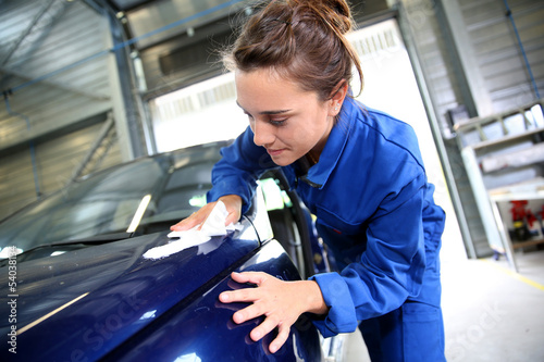 Coachbuilding sudent working on car in repairshop