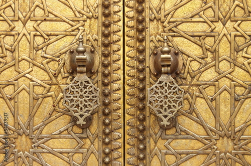 The golden door knockers of the Royal Palace in Fes, Morocco