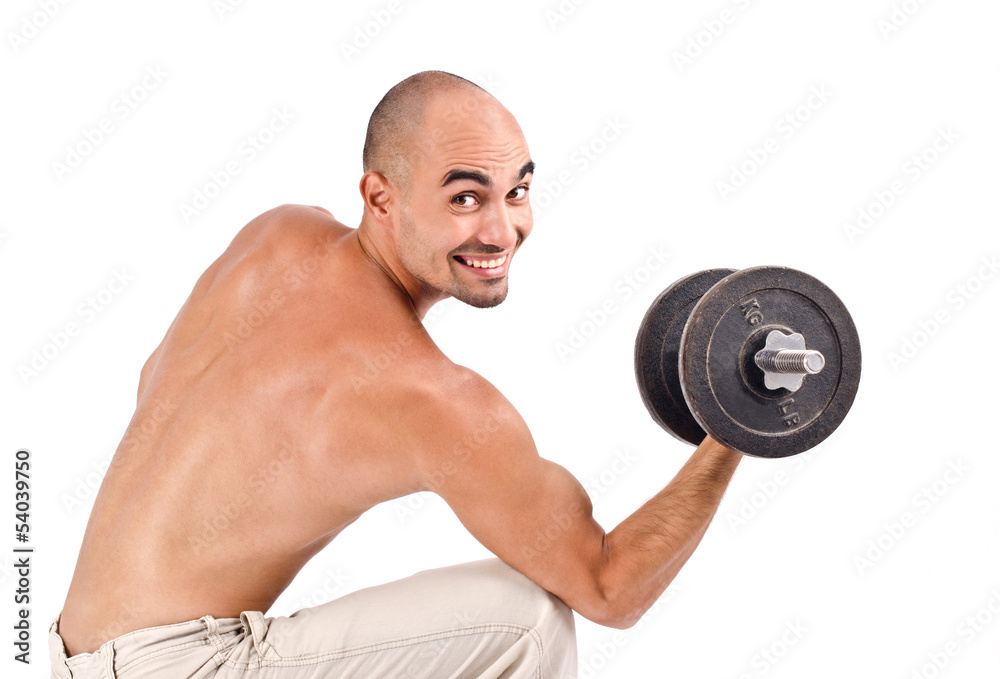 Happy bodybuilder training hard with heavy dumbbells.