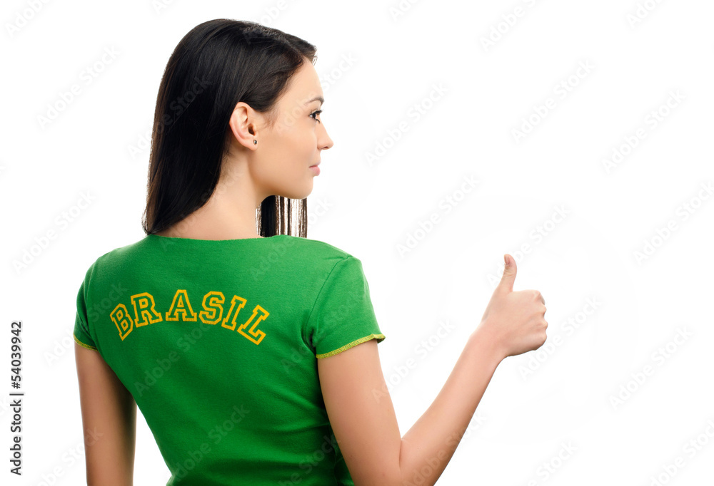 Thumbs up for Brazil.Girl with Brasil written on her t-shirt.
