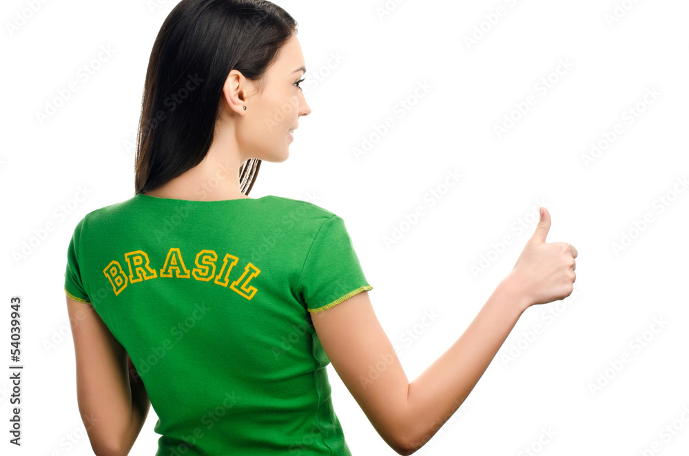 Thumbs up for Brazil.Girl with Brazilian flag on her t-shirt. Thumbs up for Brazil.Girl with Brazilian flag on her t-shirt.