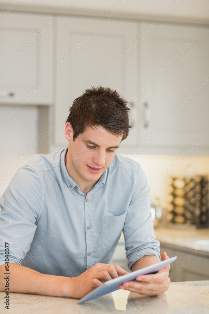 Man touching his tablet screen Man touching his tablet screen