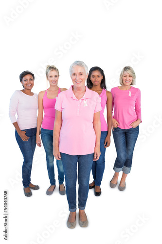 Diverse group of happy women wearing pink tops and breast cancer