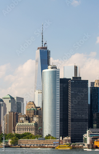 The Freedom Tower and Lower Manhattan buildings on a overcast su