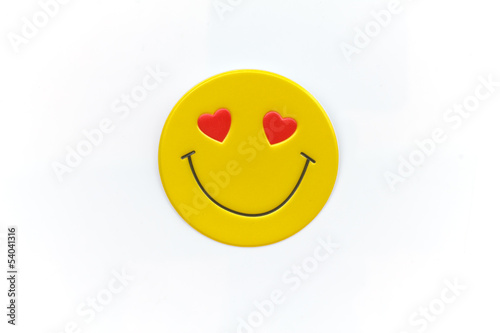 Bright, yellow sticker with a smiley face