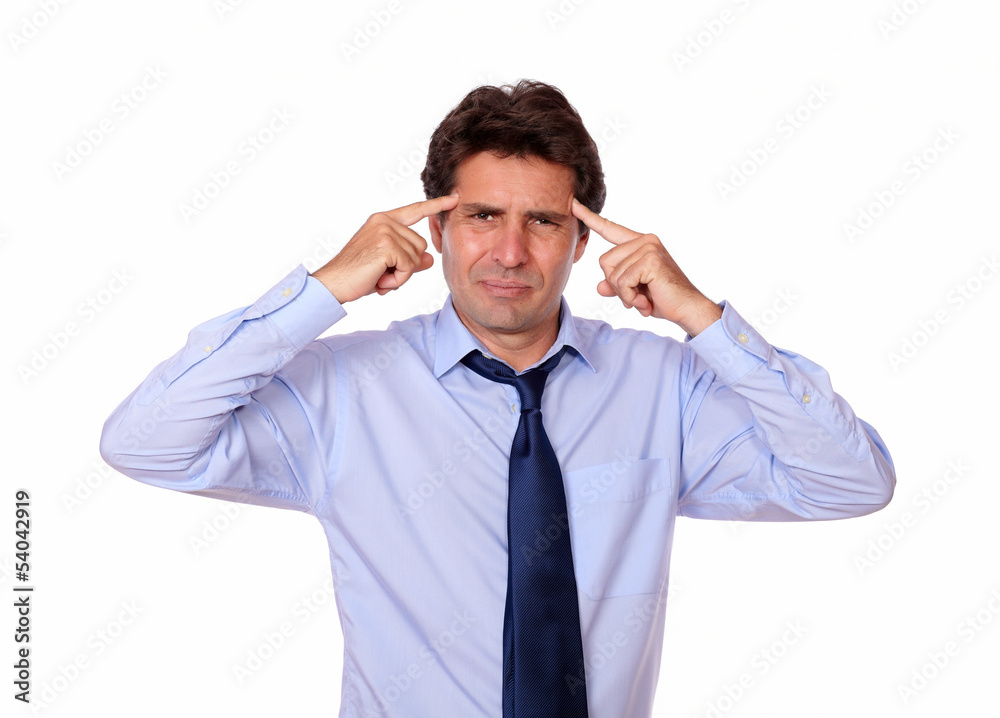 Attractive man with headache holding his forehead Attractive man with headache holding his forehead