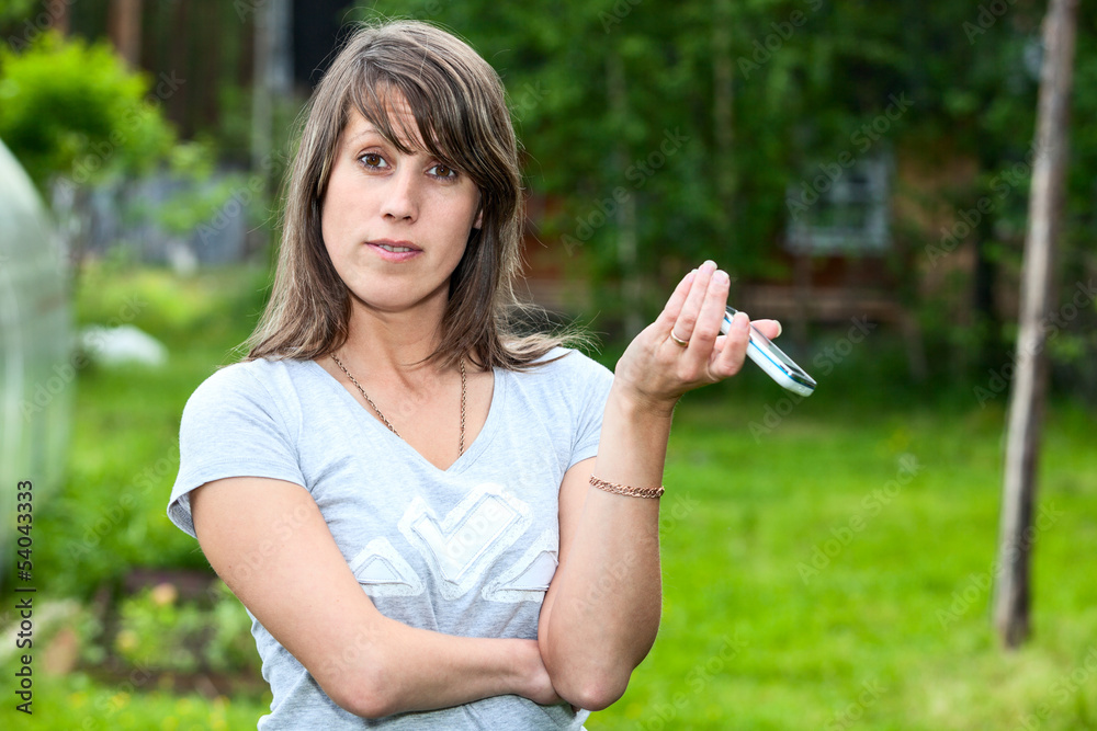 Surprised woman with cell phone nature outdoors. Copyspace Surprised woman with cell phone nature outdoors. Copyspace