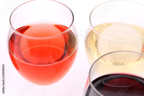 three glasses with white  rose and red wine