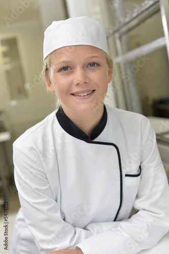 Catering school girl in restaurant kitchen