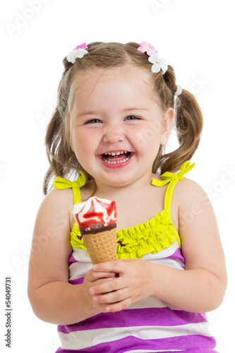 cheerful baby girl eating i...