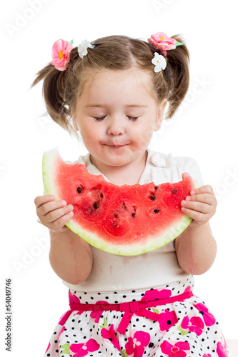 Child girl eating watermelo...