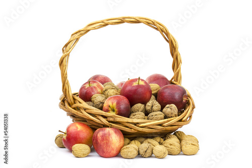 basket full of whole walnuts and apples