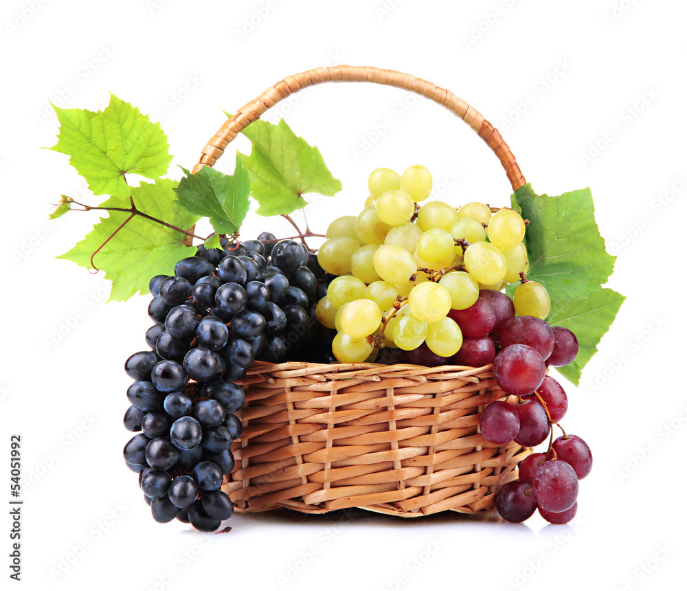 assortment of ripe sweet grapes in basket, isolated on white. assortment of ripe sweet grapes in basket, isolated on white.