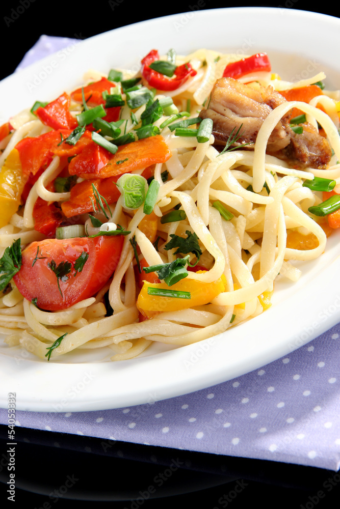 Noodles with vegetables on plate close-up Noodles with vegetables on plate close-up