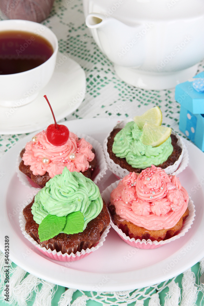 Delicious beautiful cupcakes on dining table close-up Delicious beautiful cupcakes on dining table close-up