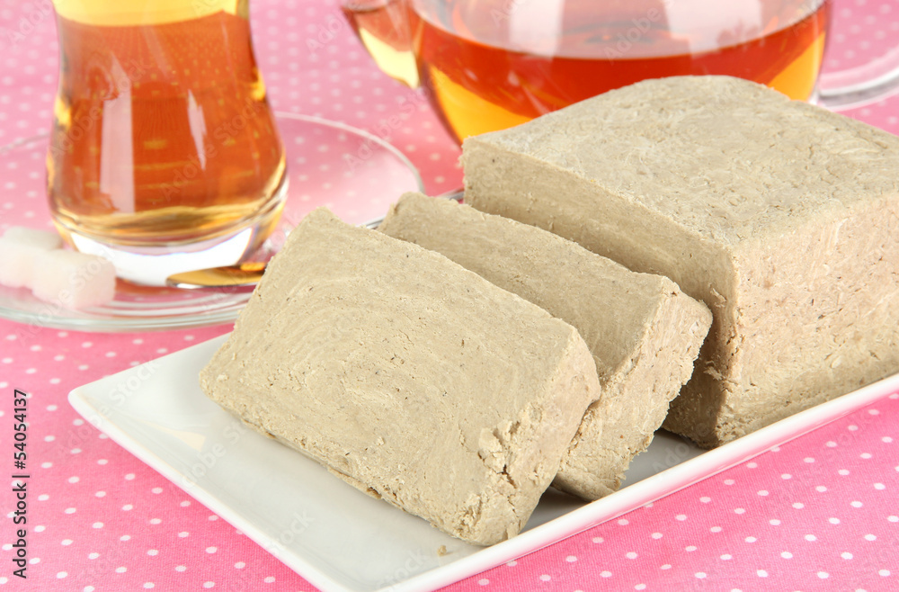 Tasty halva with tea on table close-up Tasty halva with tea on table close-up