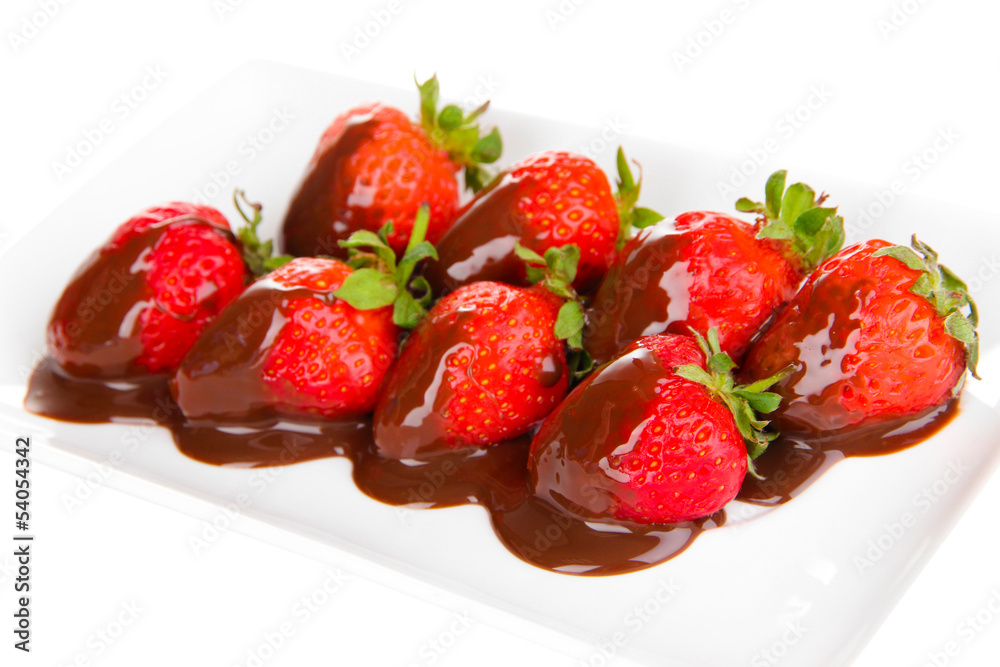 Strawberry dipped in chocolate fondue isolated on white Strawberry dipped in chocolate fondue isolated on white