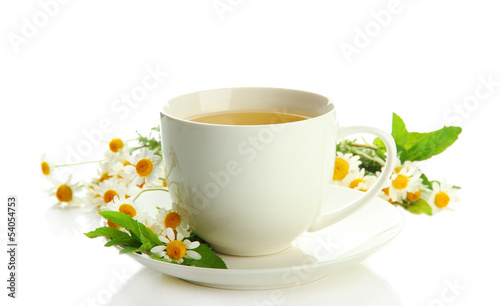 Fototapeta Naklejka Na Ścianę i Meble -  Cup of herbal tea with wild camomiles and mint, isolated