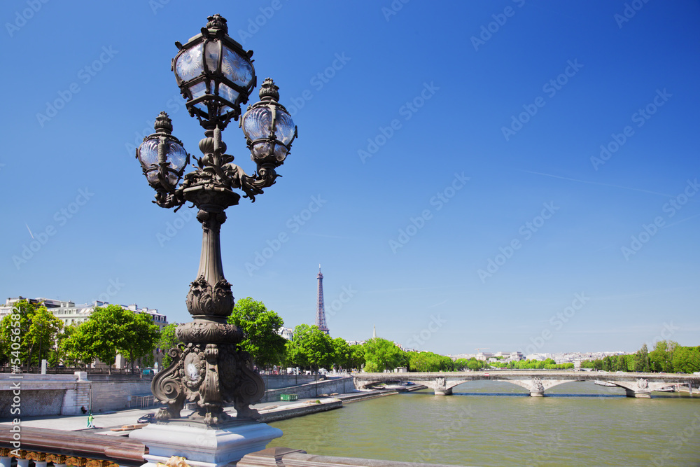 Eiffel Tower and bridge on Seine river in Paris, Fance.