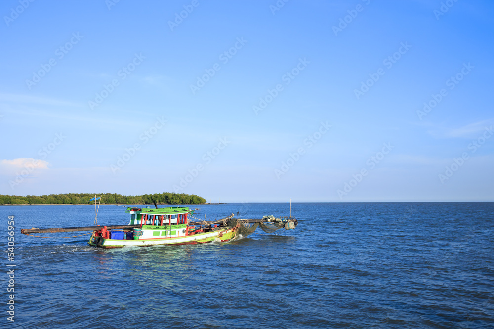 Traditional fishing boat heading for the sea