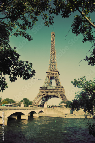 Eiffel Tower and bridge on Seine river in Paris, France. Vintage © Photocreo Bednarek