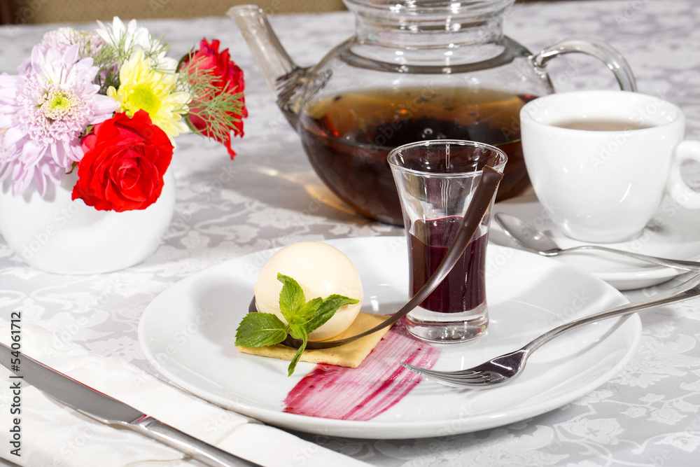 dessert, a piece of cake on the table with a cup of tea dessert, a piece of cake on the table with a cup of tea