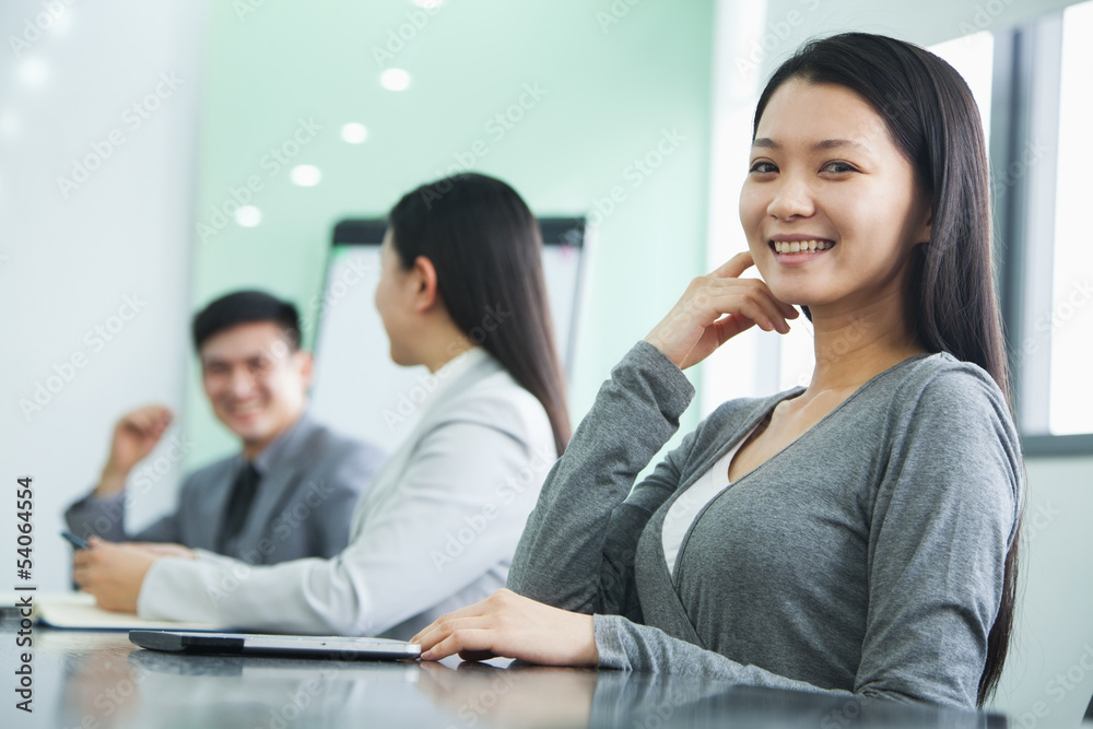 Businesswoman Looking At Camera in a Meeting Businesswoman Looking At Camera in a Meeting