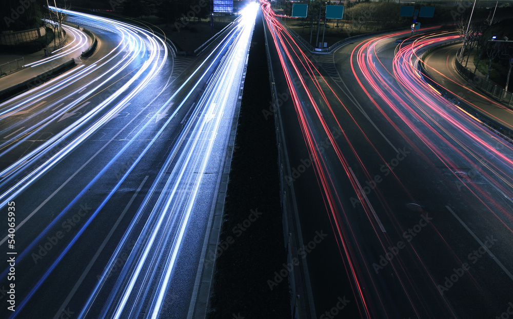 Large city road night scene, night car rainbow light trails Large city road night scene, night car rainbow light trails