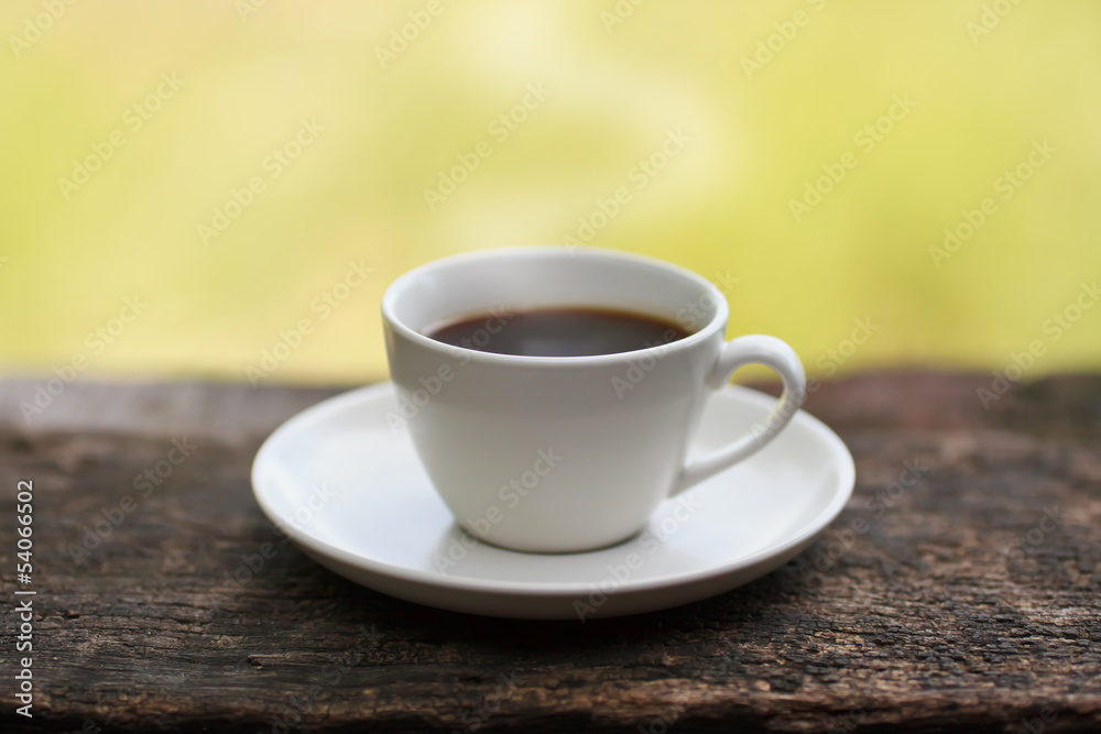Coffee cup on a wooden table Coffee cup on a wooden table