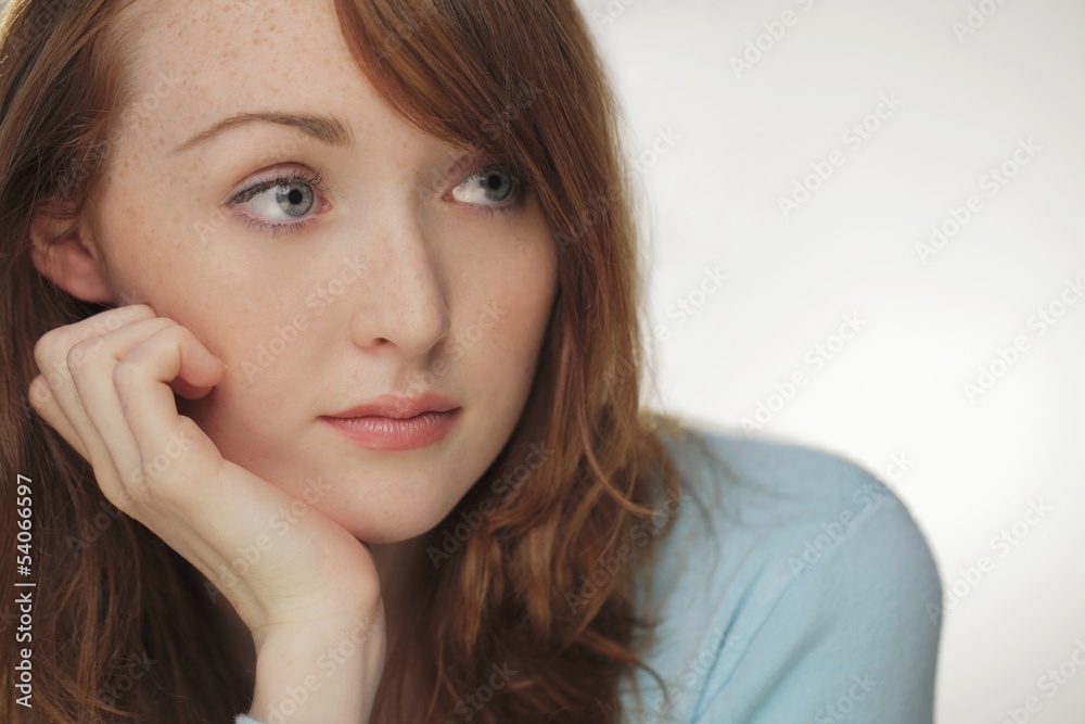 Head shot of young woman with red hair Head shot of young woman with red hair