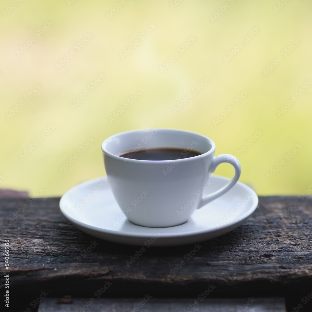 Cup of espresso on a wooden table Cup of espresso on a wooden table