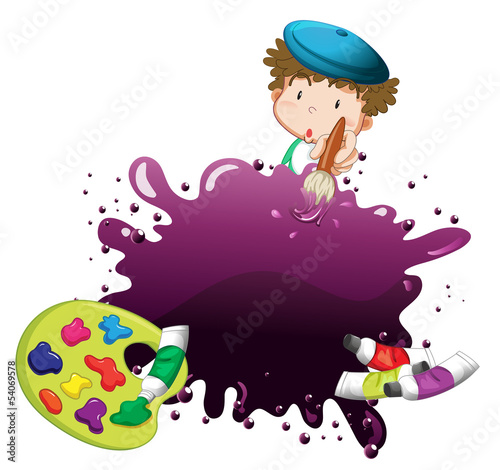A young boy painting