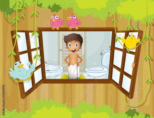 A boy with a towel inside the bathroom