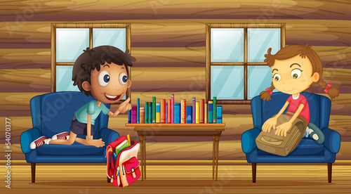 A boy and a girl with their schoolbags inside the house