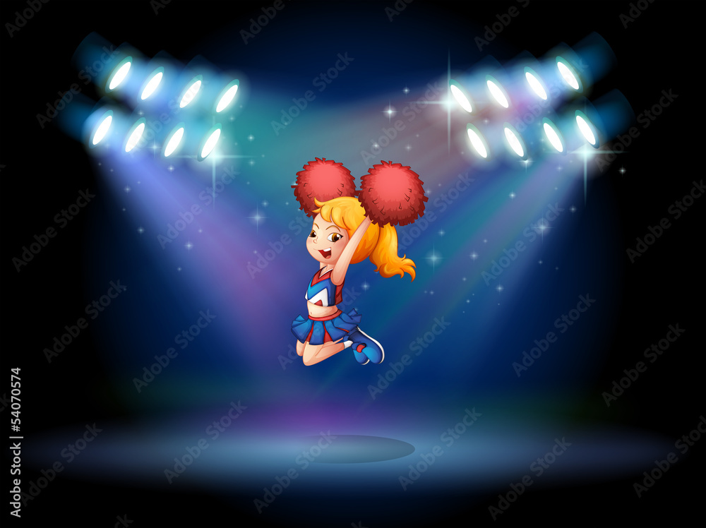 A cheerleader jumping in the middle of the stage