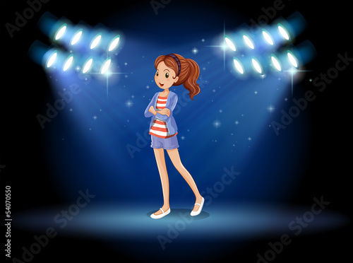 A stage with a young lady standing