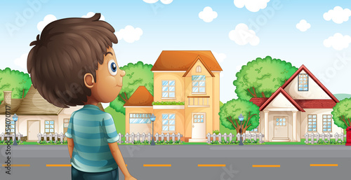 A young boy standing across the village