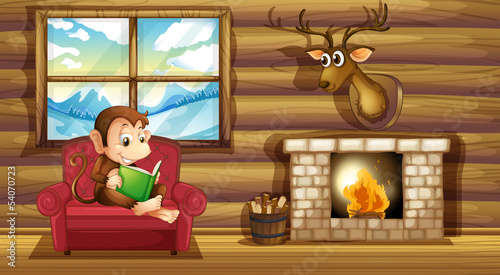 A monkey reading at the chair near the fireplace