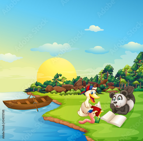 A worm, a duck and a panda reading at the riverbank