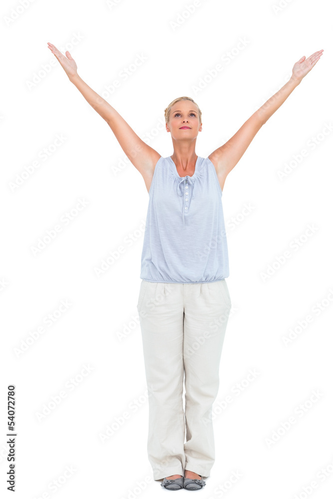 Blonde woman standing with arms outstretched Blonde woman standing with arms outstretched
