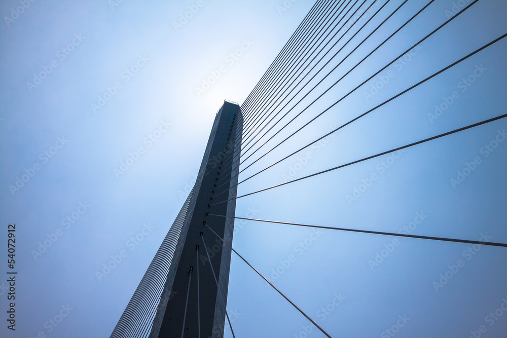 Fragment of a cable stayed bridge on the sky background. Fragment of a cable stayed bridge on the sky background.
