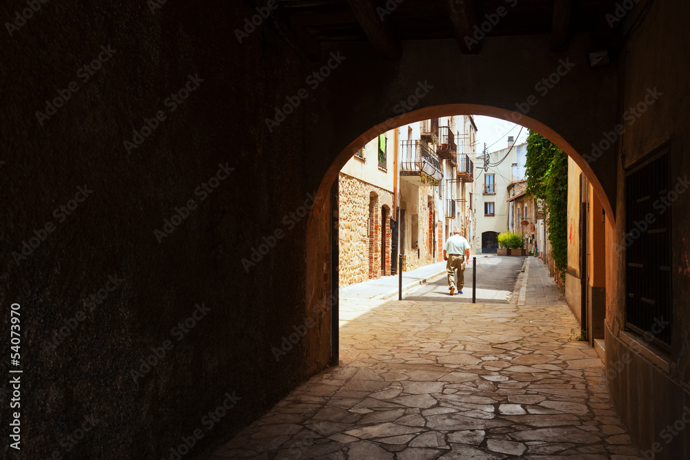 Old street with archway in the European town