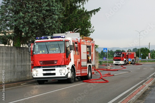 firefighters with the fire truck when switching off a fire