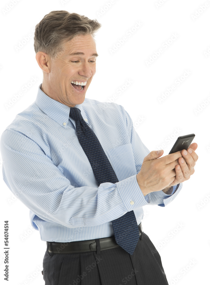 Excited Businessman Reading Text Message On Smart Phone Excited Businessman Reading Text Message On Smart Phone