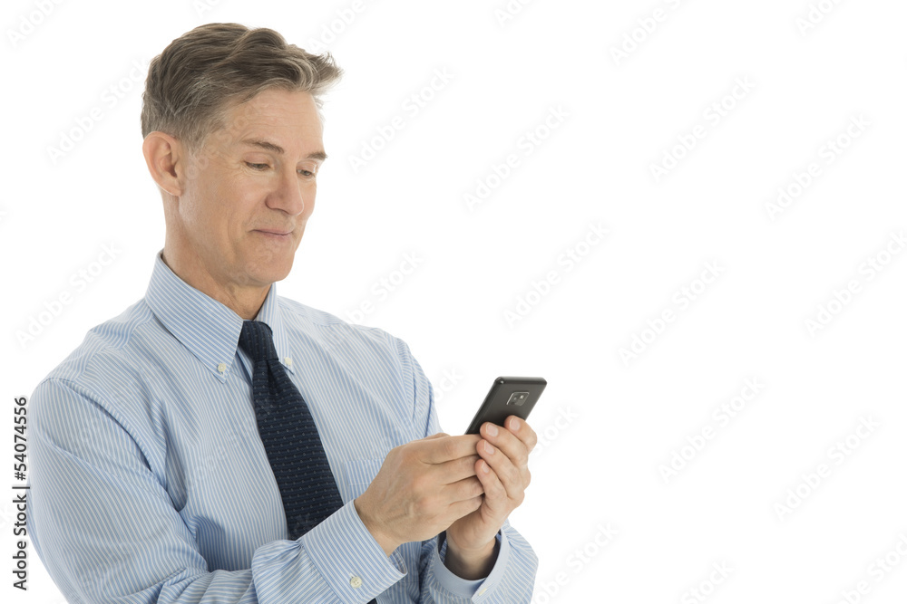 Handsome Businessman Text Messaging On Mobile Phone Handsome Businessman Text Messaging On Mobile Phone
