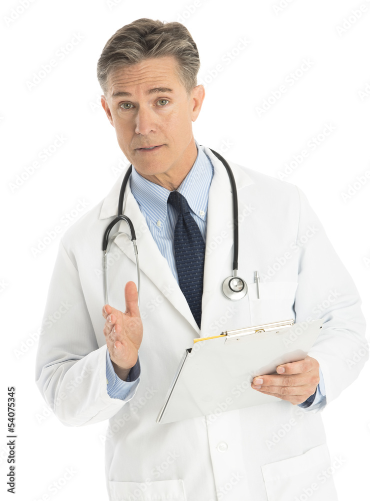 Portrait Of Confident Doctor Gesturing While Holding Clipboard Portrait Of Confident Doctor Gesturing While Holding Clipboard
