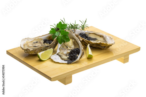 Oysters with black cavair photo