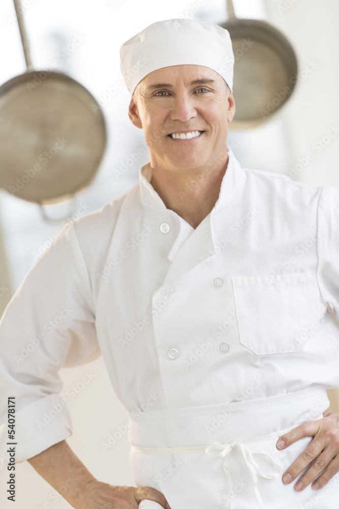Confident Chef Standing In Commercial Kitchen