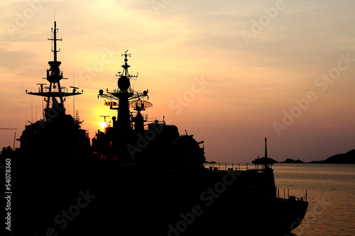 battleship with sunset behind