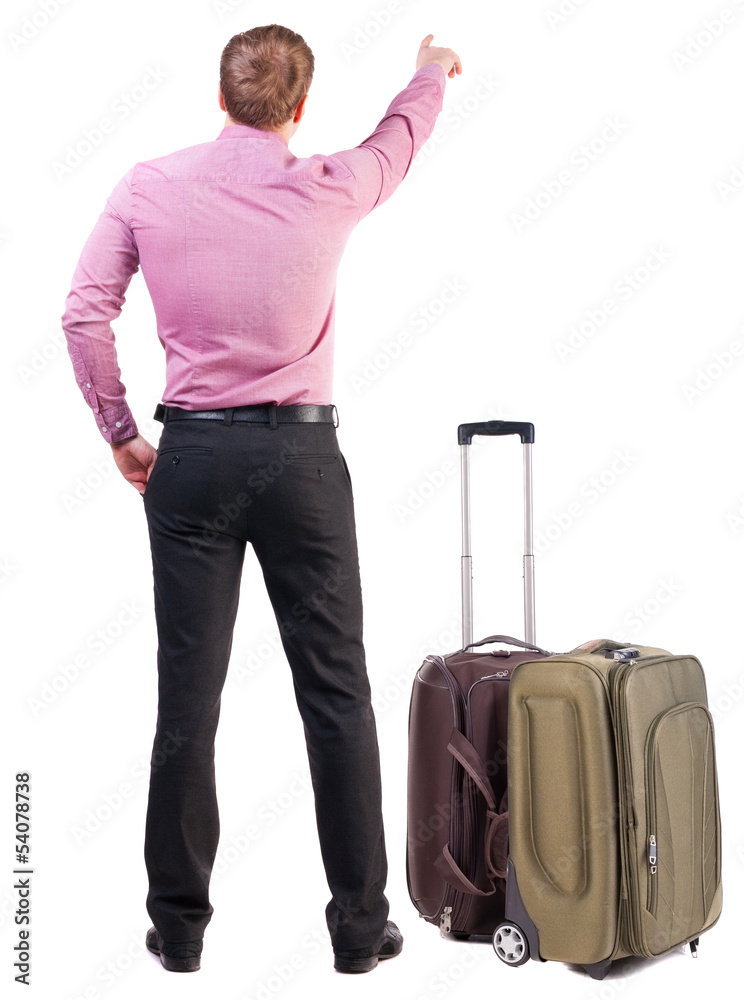 Back view of traveling business man with suitcase pointing. Back view of traveling business man with suitcase pointing.